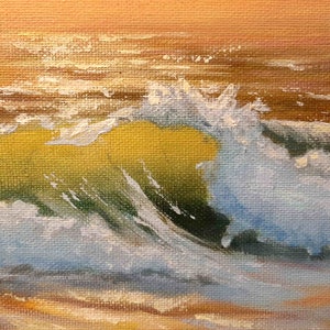 May include: A close-up of a painting depicting a wave crashing in the ocean. The wave is white with blue and green hues, and the background is a warm orange.