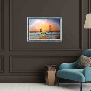 May include: A framed oil painting depicting a sailboat on a calm sea at sunset. The painting features a large ship in the distance and a smaller sailboat in the foreground. The sky is a vibrant orange and pink, and the water is a deep blue.