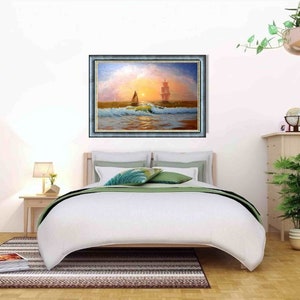 May include: A framed painting of a sailboat on the ocean at sunset. The painting is hanging on a white wall above a bed with white bedding and green pillows.