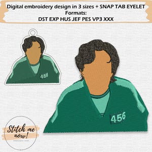 May include: Digital embroidery design featuring a character in a green uniform with the number 456. The design includes a small keychain version and a larger image. The text "Stitch me now!" is also present.