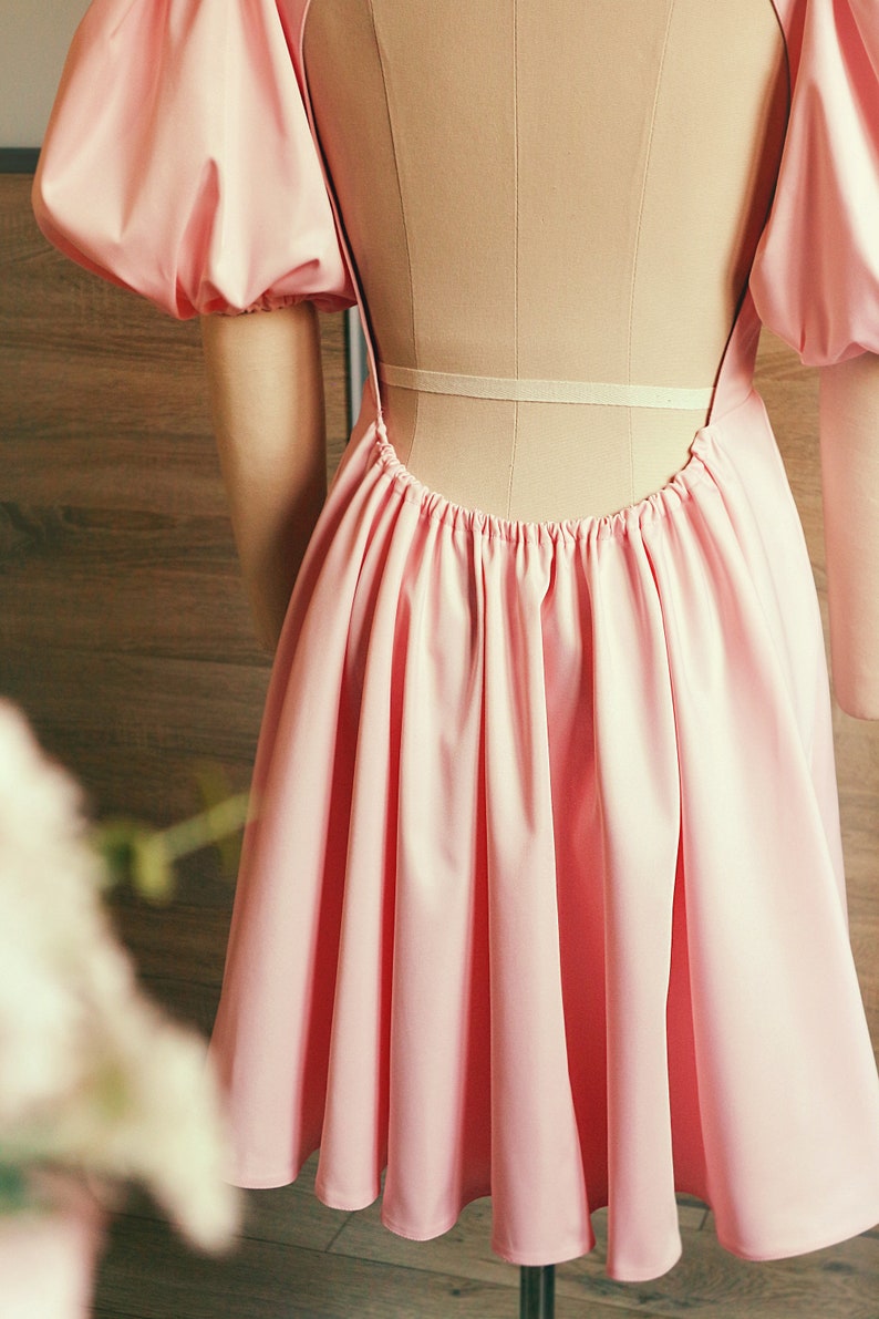 The photo shows the bottom of the dress skirt.
Close-up