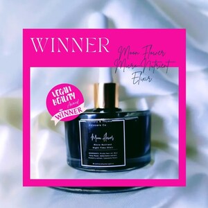 May include: A dark glass dropper bottle labeled Moon Flower Micro-Nutrient Night Time Elixir by Rosemary & Thyme Skincare Co. The bottle features a gold cap and a pink circular sticker that reads Vegan Beauty Award Winner, with Winner text above.