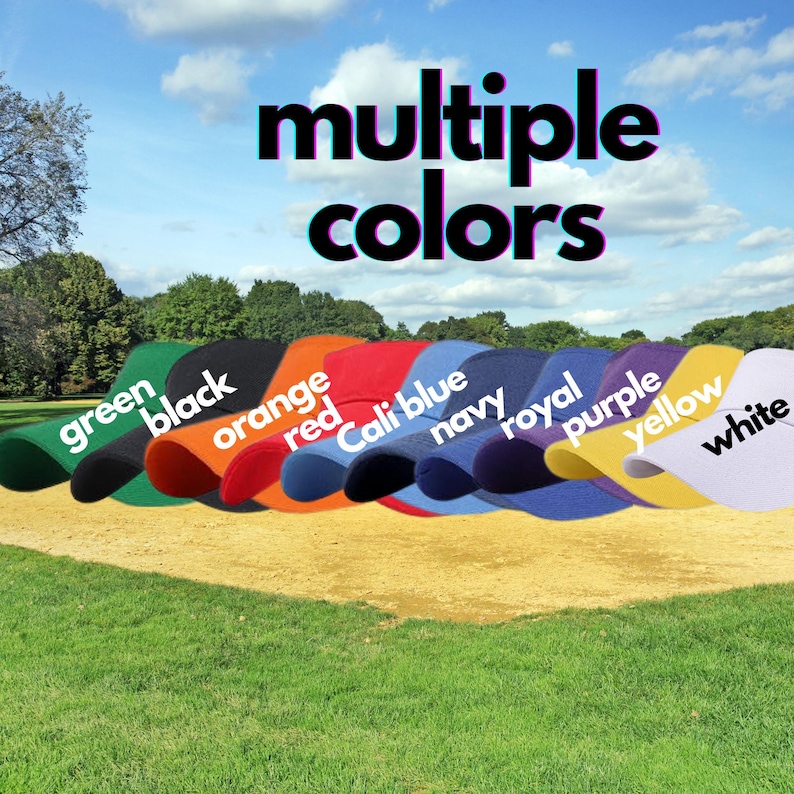 May include: A row of ten baseball caps in different colors, including green, black, orange, red, blue, navy, royal, purple, yellow, and white. The caps are arranged in a line on a grassy surface with the words "multiple colors" above them.