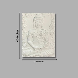 May include: White 3D wall art sculpture of a meditating Buddha, 30 inches wide and 40 inches tall. The sculpture is detailed with floral designs and a serene expression on the Buddha's face.
