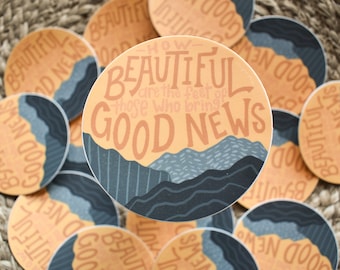 May include: A collection of round stickers with a mountain landscape design. The stickers feature the text "How beautiful are the feet of those who bring good news".