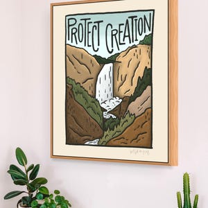 May include: A framed illustration of a waterfall in a canyon with the text "PROTECT CREATION" above it. The illustration is in a cartoon style with brown, green, and blue colours.