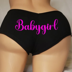 May include: Black underwear with a pink "Babygirl" graphic.