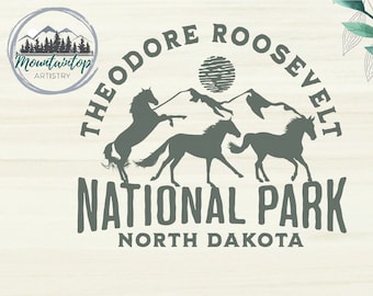 May include: A green and white logo design for Theodore Roosevelt National Park in North Dakota. The logo features a circle with the words "Theodore Roosevelt National Park" and "North Dakota" inside. There are three horses running in front of a mountain range with a sun in the background.