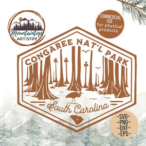 May include: A brown vintage-style logo with the text "CONGAREE NAT'L PARK" and "South Carolina" with a silhouette of trees and a bird. The logo is set against a watercolor background of mountains and trees.
