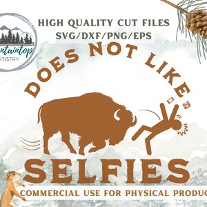 May include: A brown silhouette of a bison with a person running away from it. The text "DOES NOT LIKE SELFIES" is written in a brown font around the bison and person. The text "HIGH QUALITY CUT FILES SVG/DXF/PNG/EPS" is written in black at the top of the image. The text "COMMERCIAL USE FOR PHYSICAL PRODUCTS" is written in black at the bottom of the image.