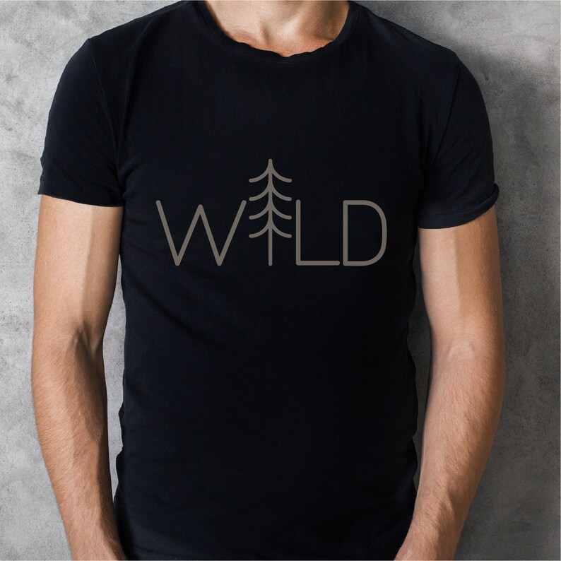 May include: A black t-shirt with a simple design of a pine tree and the word "WILD" in white.