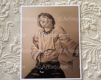 May include: A black and white drawing of a person with short hair wearing a brown shirt, black pants, and a silver chain with the word "Genie" on it.