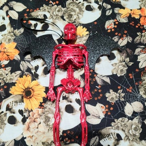Sparkly Red Skeleton with Bat Wings