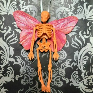 Orange Skeleton with Wings