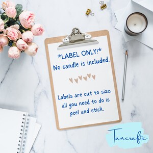 May include: A white clipboard with a brown backing, with the text "*LABEL ONLY!* No candle is included." and "Labels are cut to size. all you need to do is peel and stick."  The text is in blue. There are five small brown hearts below the first line of text. The clipboard is on a white marble surface. The text "Tancraftic" is in blue on a light blue background in the bottom right corner of the image.
