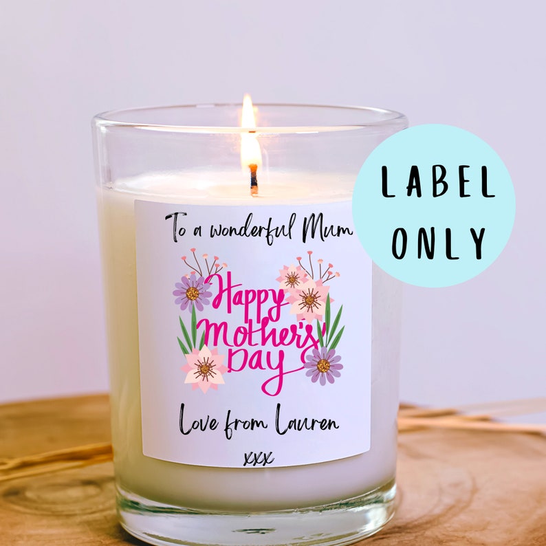 May include: White candle with a pink and purple floral design label that says "To a wonderful Mum. Happy Mother's Day. Love from Lauren xxx"