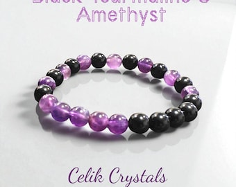 May include: A bracelet made of alternating black tourmaline and amethyst beads. The round, polished beads are strung together. The image includes the text "Black Tourmaline & Amethyst" and "Celik Crystals".
