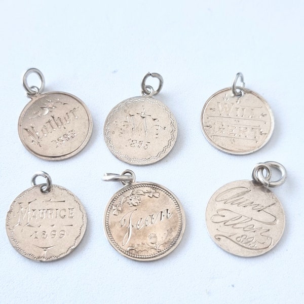 6 antique silver coin charms, Mother, W, Will/Gert, Maurice, Jean, Aunt Ellen. Individually sold, priced. CH/26 +6