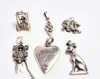 3 left, silver charms or pendants. Priced and sold individually. CH/53