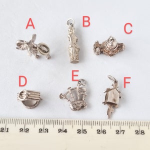 2 vintage 1960s/70s sterling silver charms, individually priced. CH16