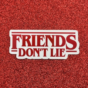 May include: White sticker with red text that reads "Friends Don't Lie" in a bold, blocky font. The text is framed by a red border.