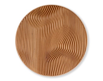 May include: A round wooden tray with a carved pattern of wavy lines. The tray is made of light brown wood and has a natural finish.