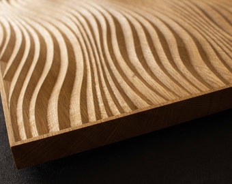 May include: A rectangular wooden panel featuring a series of deep, parallel, undulating wave-like grooves carved into the surface. The natural light brown wood grain is visible across the textured, rhythmic pattern of the carved ridges.