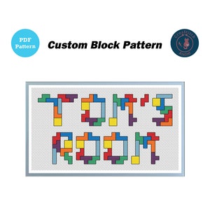 May include: Cross stitch pattern for "TOM'S ROOM" in a block pattern using various colors, including red, yellow, blue, green, and purple.