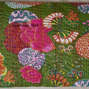 May include: A green floral quilt with a vibrant design. The quilt features large pink, orange, and white flower patterns, along with other colorful shapes. The text "Countdown Mart" is visible on the quilt.