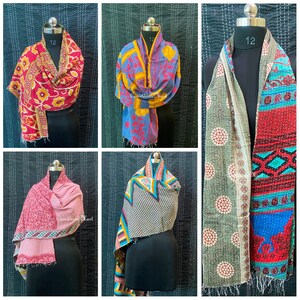 May include: Six different kantha quilts, each with a unique pattern and color combination. The quilts are made of recycled saris and are hand-stitched. They are perfect for adding a touch of color and warmth to any room.