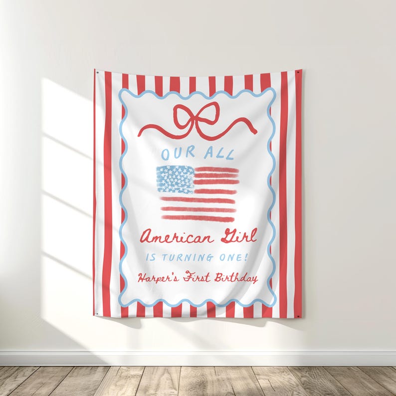 May include: A red and white striped tapestry with a white center featuring a red bow, an American flag, and the text "OUR ALL American Girl IS TURNING ONE! Harper's First Birthday."