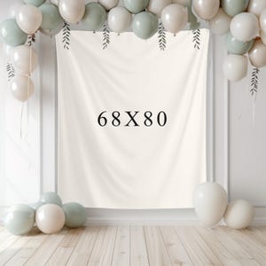 May include: A cream-colored backdrop with the text "68X80" in black. The backdrop is decorated with green and white balloons and hanging leaf designs. The backdrop measures 68 inches by 80 inches.