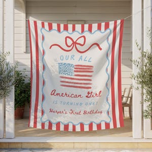 May include: A red and white striped banner with the text "OUR ALL American Girl is turning one! Harper's First Birthday" and a watercolor American flag design. The banner is hanging outside.