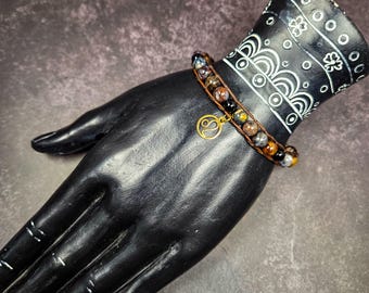 Pietersite and Black Onyx Bracelet with Leo Zodiac Charm: Strength, Courage, and Fiery Determination
