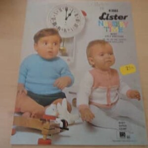 May include: A vintage magazine cover featuring two babies, one in a blue sweater and the other in a pink and white sweater. The magazine is titled "Lister Nursery Time" with a clock in the background.