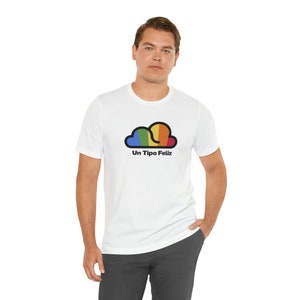 May include: White t-shirt with a rainbow cloud graphic and the text "Un Tipo Feliz" printed on the front.