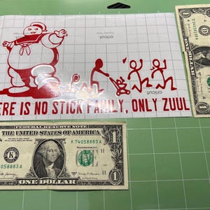May include: Red vinyl sticker with a cartoon ghost character and the text "THERE IS NO STICK FAMILY, ONLY ZUUL".
