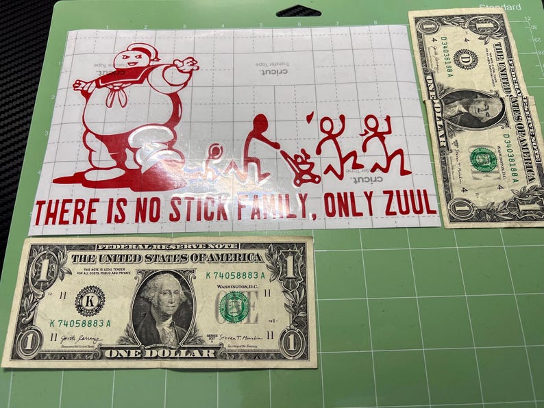 May include: Red vinyl sticker with a cartoon ghost character and the text "THERE IS NO STICK FAMILY, ONLY ZUUL".