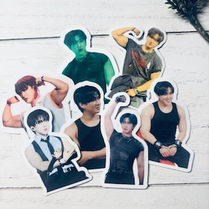 May include: Set of seven stickers featuring different men in various poses. The stickers are printed on white paper and feature a glossy finish.