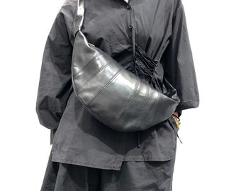 Soft leather sling bag for women, black crossbody sling backpack, adjustable shoulder strap