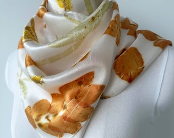 Silk scarf eco printed with Eucalyptus leaves and flowers, white with red and green prints