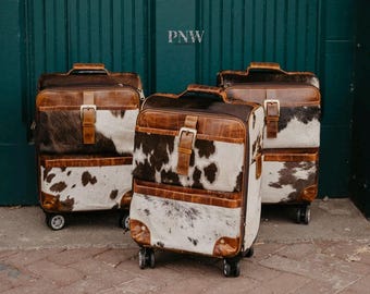 360 rolling cowhide suitcase carry on purchase separately or with accessories.