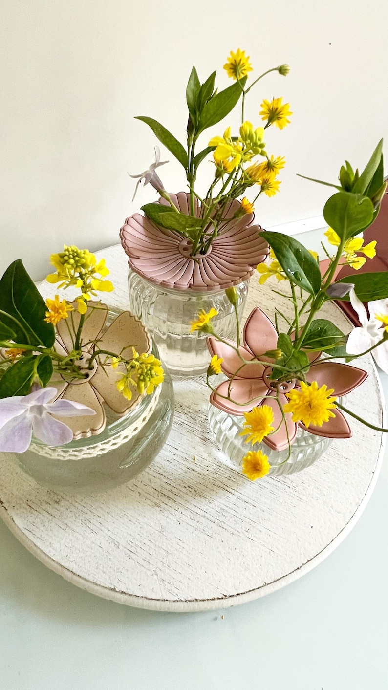 May include: A set of three ceramic mugs with a speckled, matte finish. The mugs are in shades of cream, light gray, and dark gray. Each mug has a simple, minimalist design, perfect for coffee or tea.