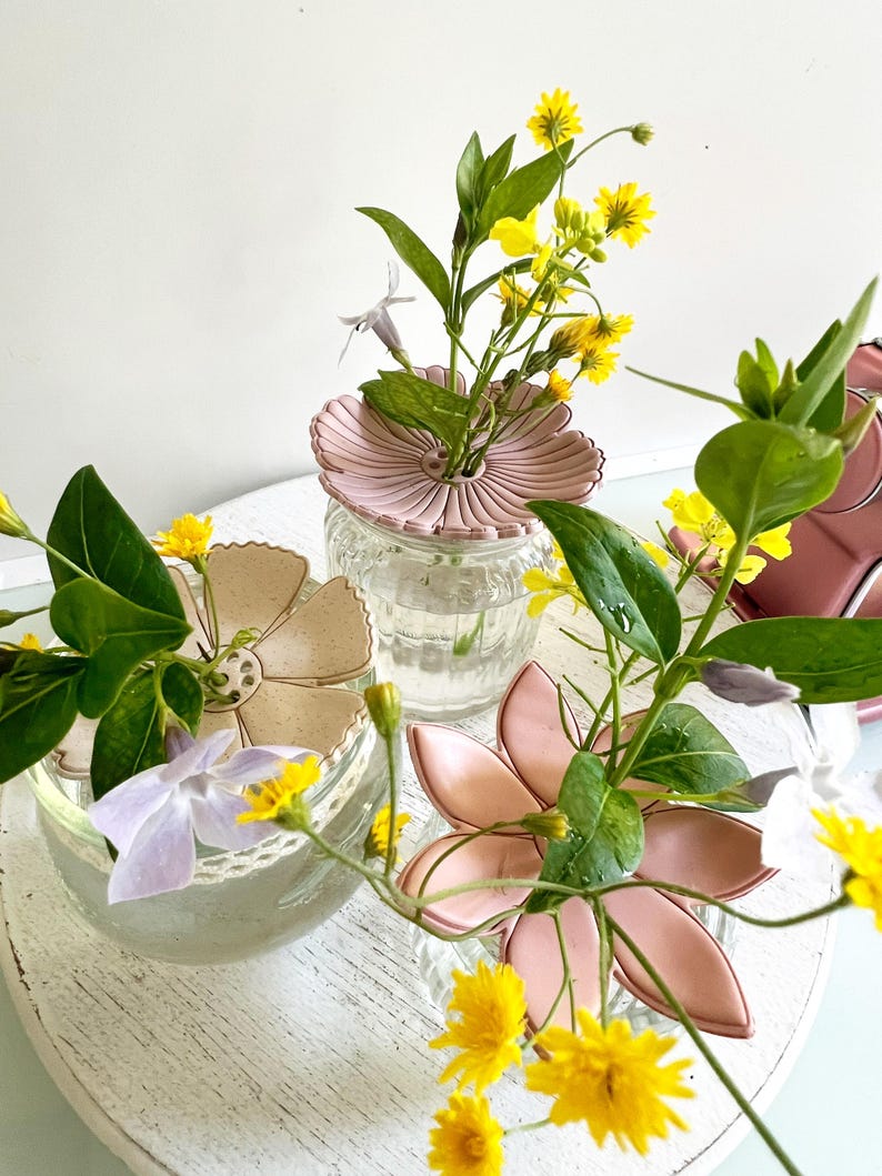 May include: A set of three ceramic mugs with a speckled, matte finish. The mugs are in shades of cream, light gray, and dark gray. Each mug has a simple, minimalist design, perfect for coffee or tea.