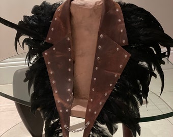 Leather vest with feathers