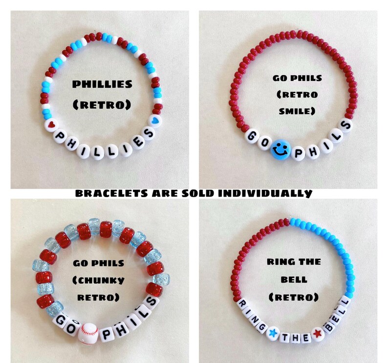May include: Four beaded bracelets with white letter beads spelling "PHILLIES", "GO PHILS", and "RING THE BELL". The bracelets feature red, white, and blue beads, with a baseball and a smiley face. Text reads "BRACELETS ARE SOLD INDIVIDUALLY".