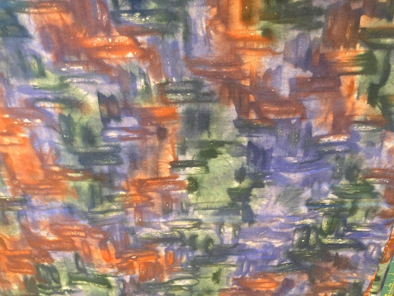 May include: Abstract watercolor pattern featuring brushstrokes in shades of orange, blue, green, and purple. The design has a textured appearance, with overlapping colors creating depth and visual interest. The overall effect is artistic and expressive.