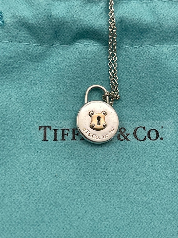 Sale Authentic Tiffany Co. Silver and 18K Gold Round Mini Lock