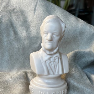 May include: White porcelain bust of Richard Wagner on a white base with the inscription "1813 WAGNER".