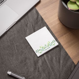 May include: White notepad with a green leafy border and the text "Mrs. Smith" at the bottom.